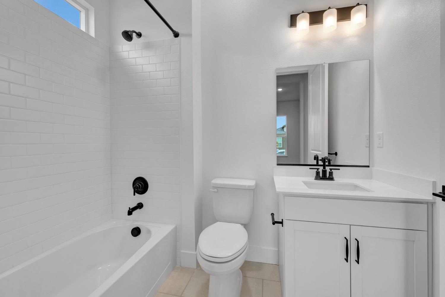 4327 Hooded Crow Way Rancho Cordova, CA 95742 - Photo 37 of 58 a bathroom with a sink toilet and shower
