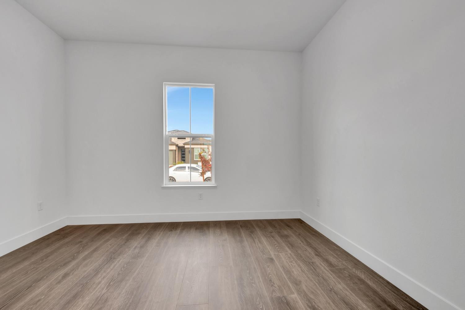 4327 Hooded Crow Way Rancho Cordova, CA 95742 - Photo 38 of 58 a view of a room that has wooden floor and window