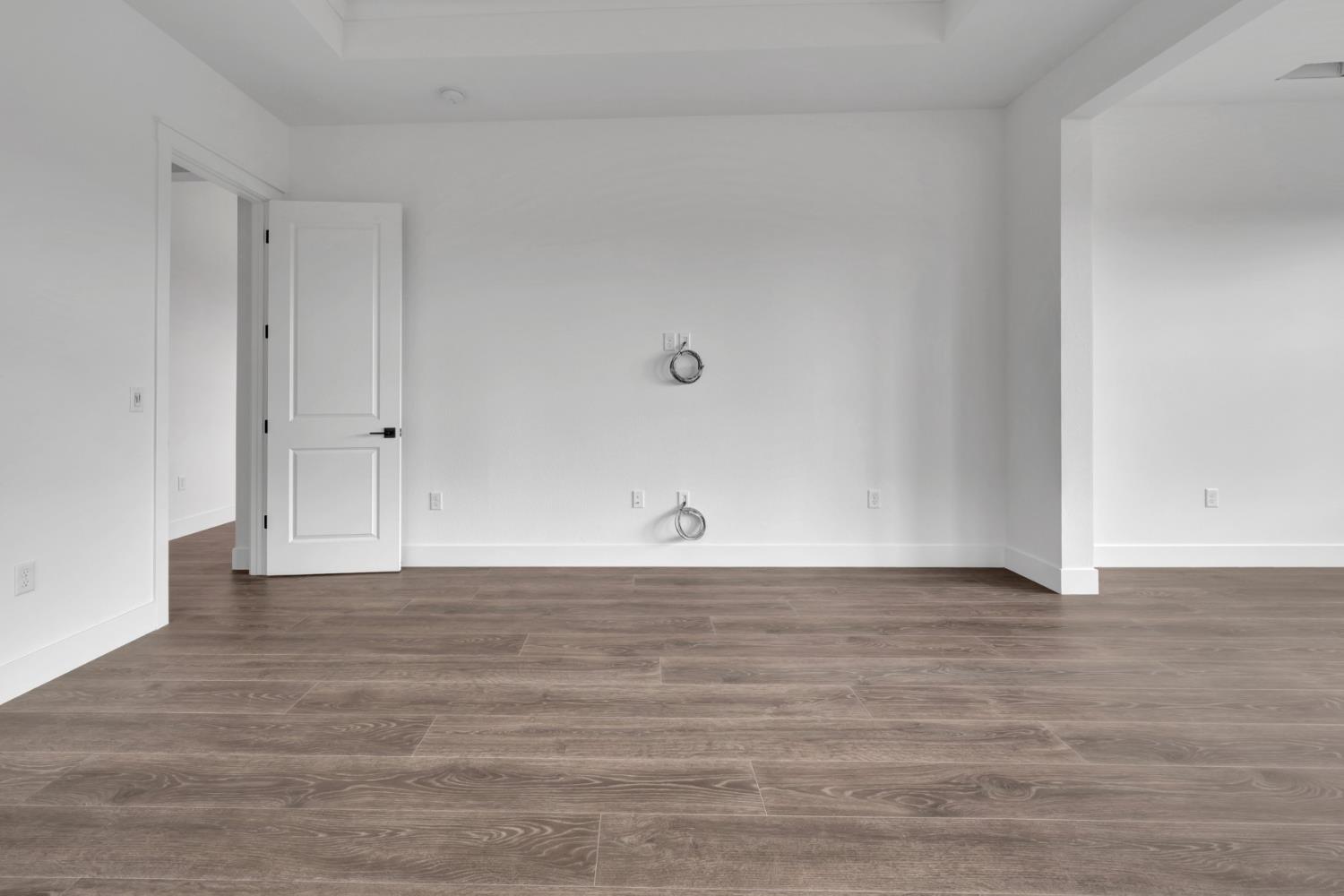 4327 Hooded Crow Way Rancho Cordova, CA 95742 - Photo 40 of 58 a view of an empty room and wooden floor