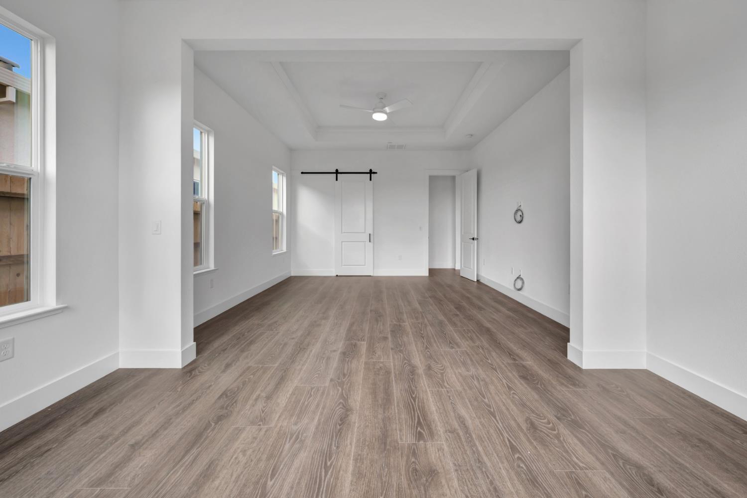 4327 Hooded Crow Way Rancho Cordova, CA 95742 - Photo 42 of 58 a view of a room with wooden floor and a window
