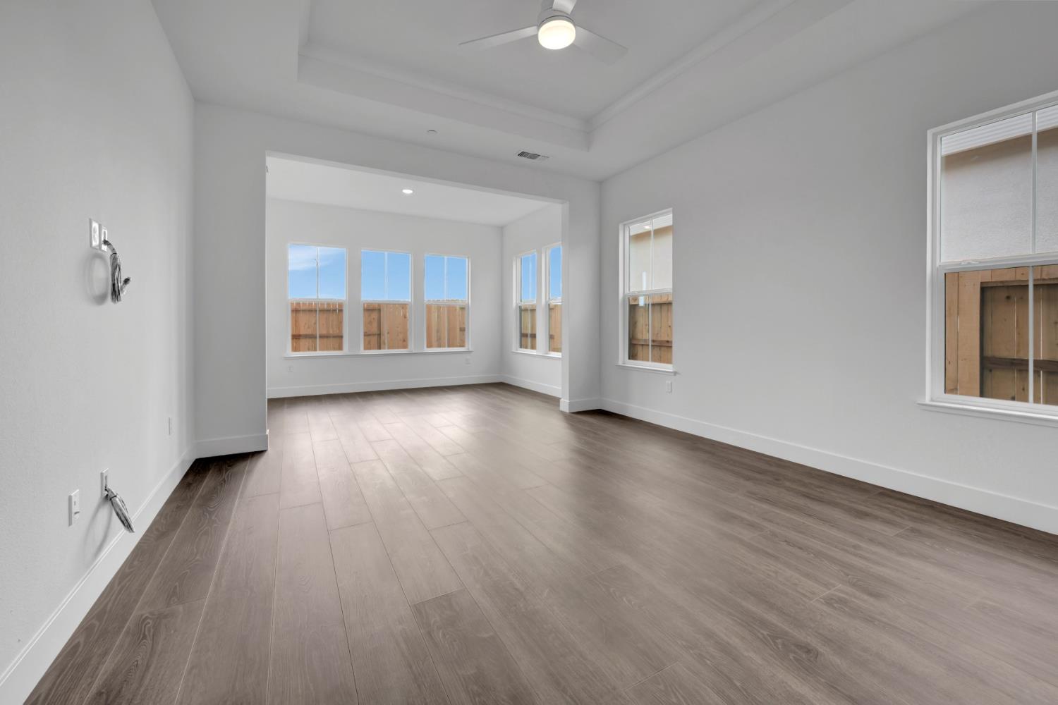 4327 Hooded Crow Way Rancho Cordova, CA 95742 - Photo 46 of 58 wooden floor in an empty room with a window