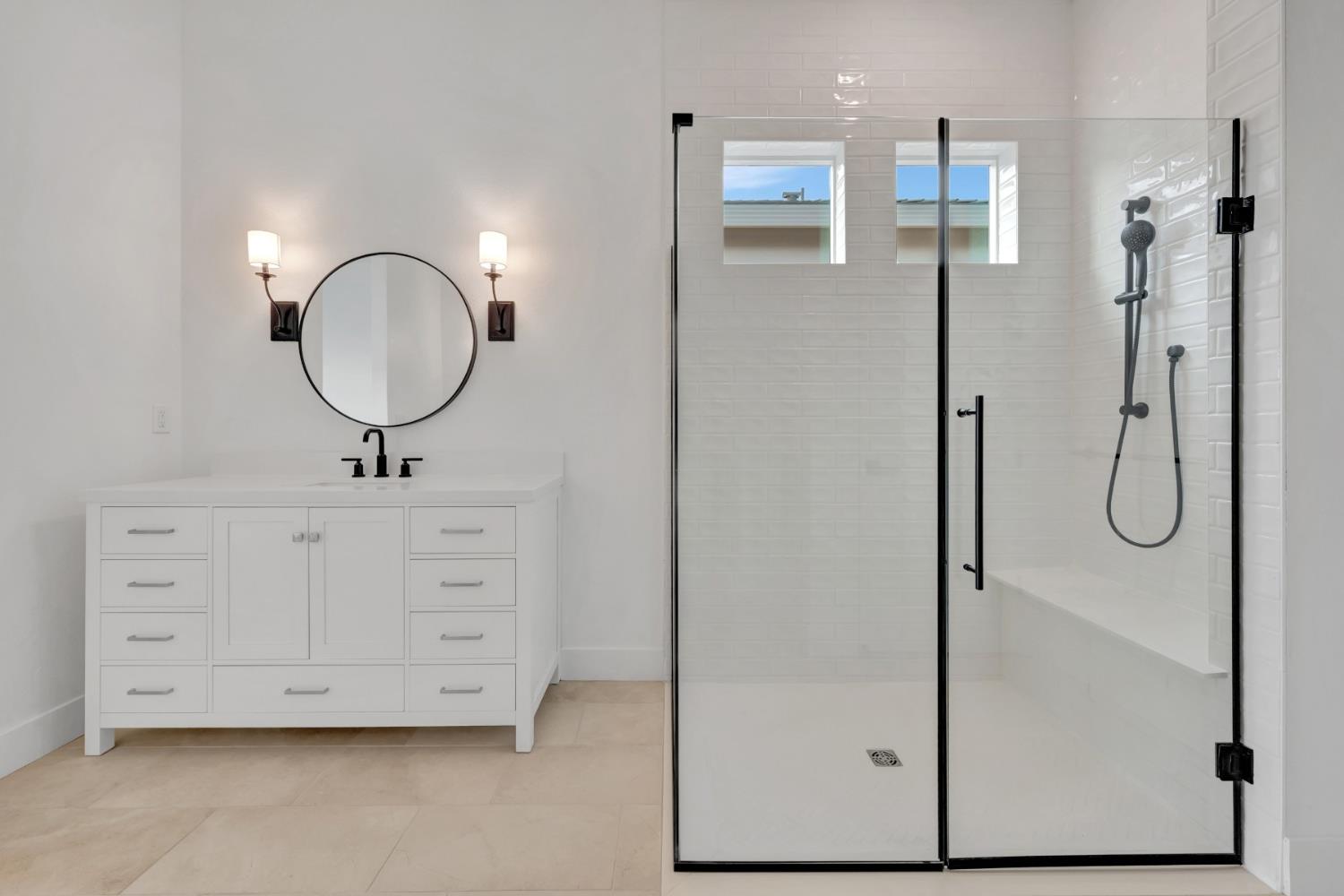 4327 Hooded Crow Way Rancho Cordova, CA 95742 - Photo 50 of 58 a bathroom with a double vanity sink mirror and shower