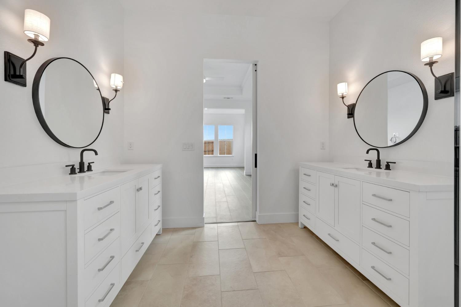 4327 Hooded Crow Way Rancho Cordova, CA 95742 - Photo 52 of 58 a bathroom with a double vanity sink double and mirror