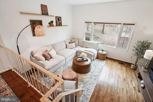 a view of a dining room with furniture and a potted plant