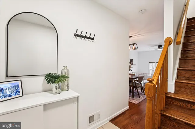 a view of an entryway with wooden floor