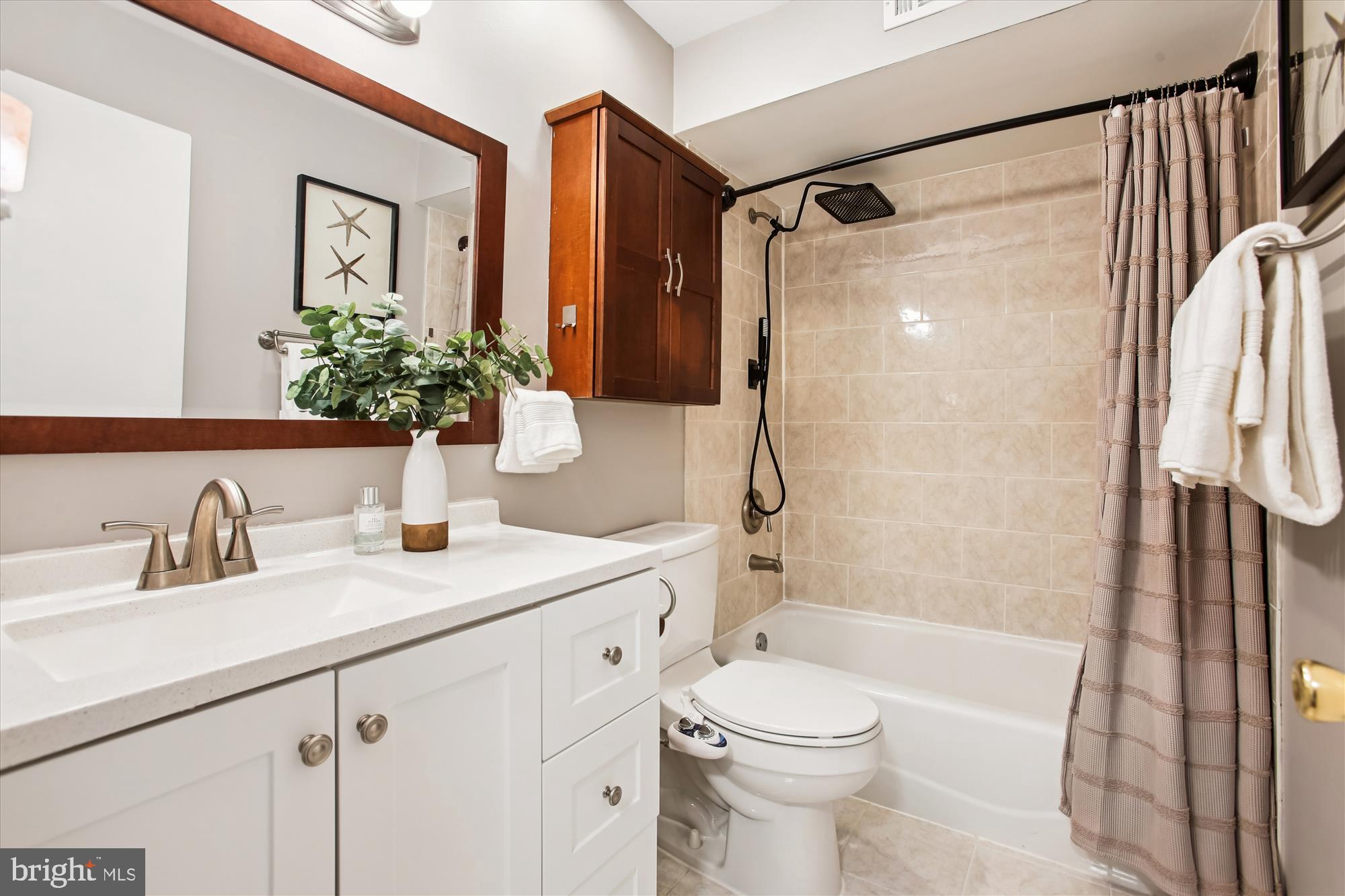5818 Torington Drive, Unit 859 Springfield, VA 22152 - Photo 20 of 46 a bathroom with a granite countertop sink toilet and shower
