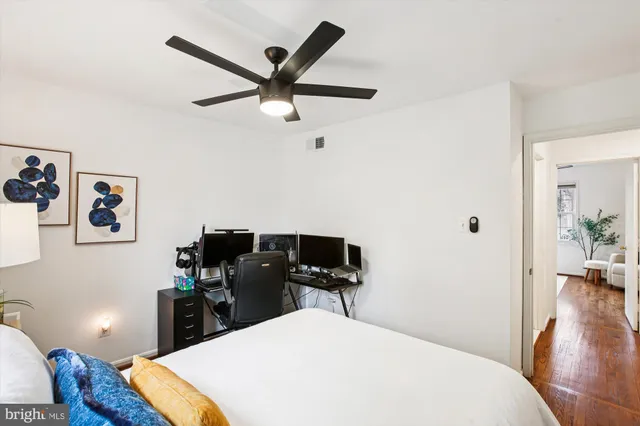 a bedroom with a bed and chair