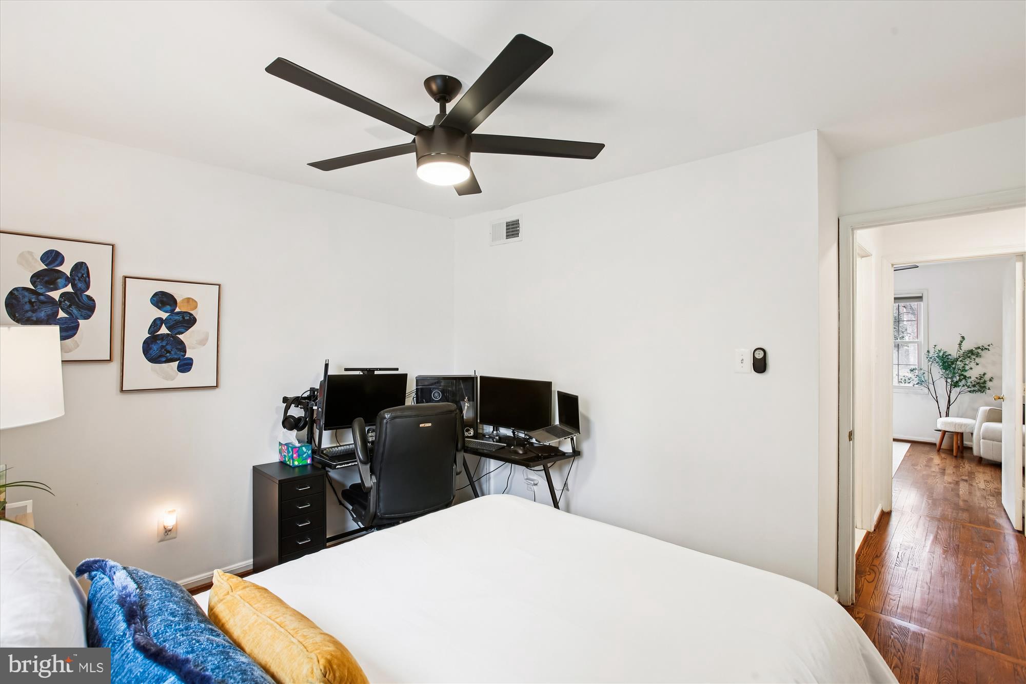 5818 Torington Drive, Unit 859 Springfield, VA 22152 - Photo 23 of 46 a bedroom with a bed and wooden floor