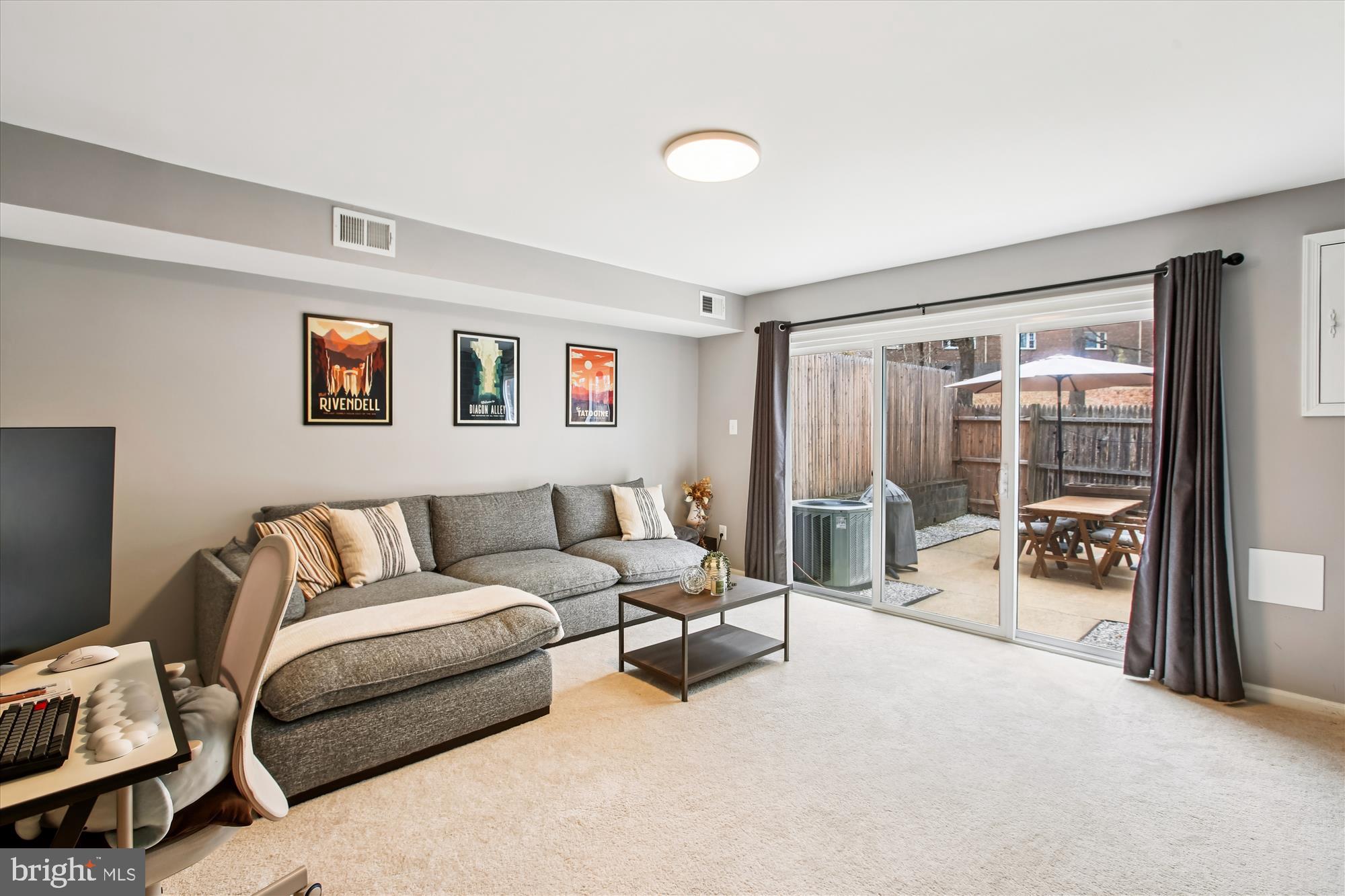 5818 Torington Drive, Unit 859 Springfield, VA 22152 - Photo 25 of 46 a living room with furniture and a flat screen tv