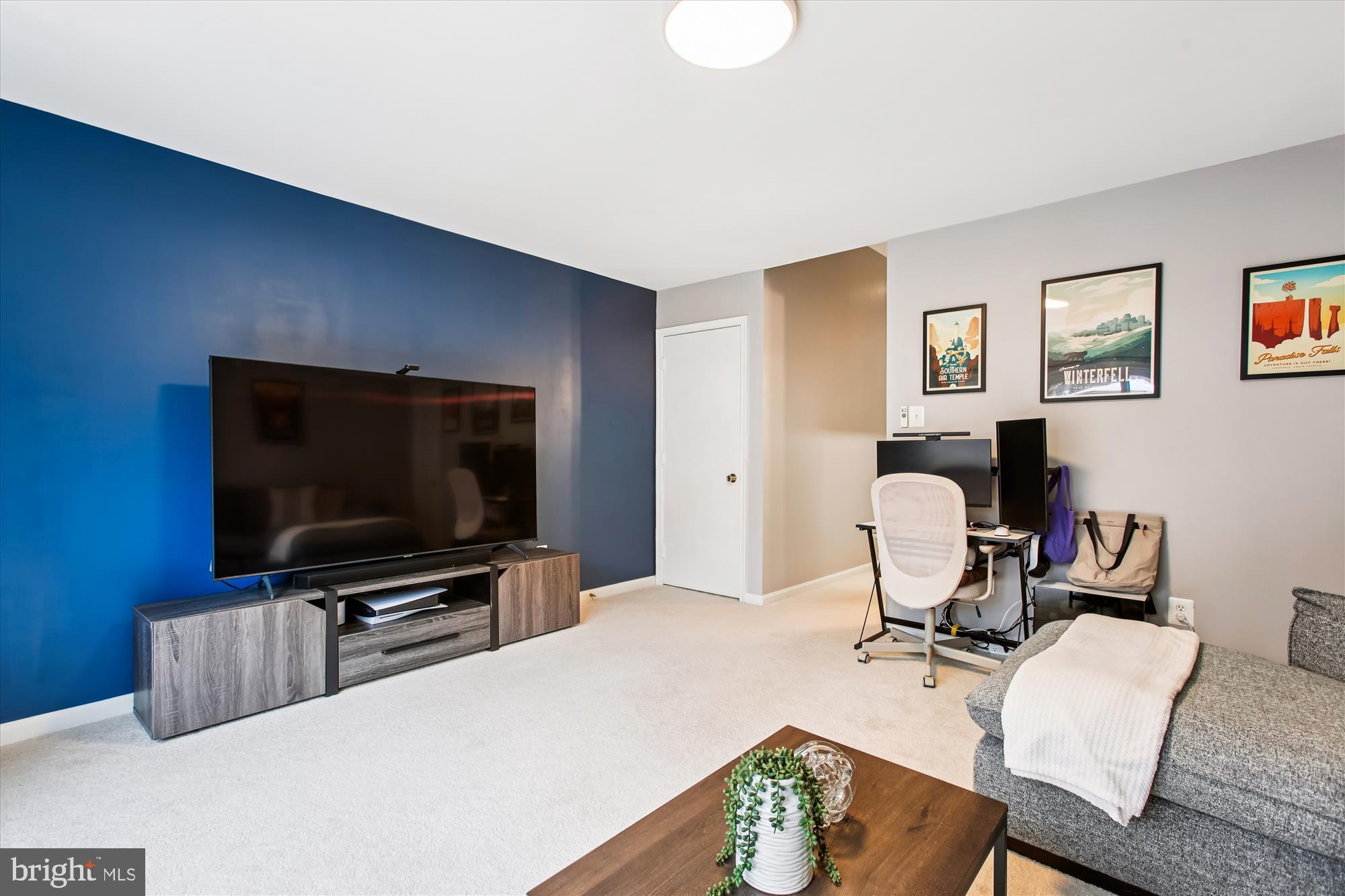 5818 Torington Drive, Unit 859 Springfield, VA 22152 - Photo 26 of 46 a living room with furniture and a flat screen tv