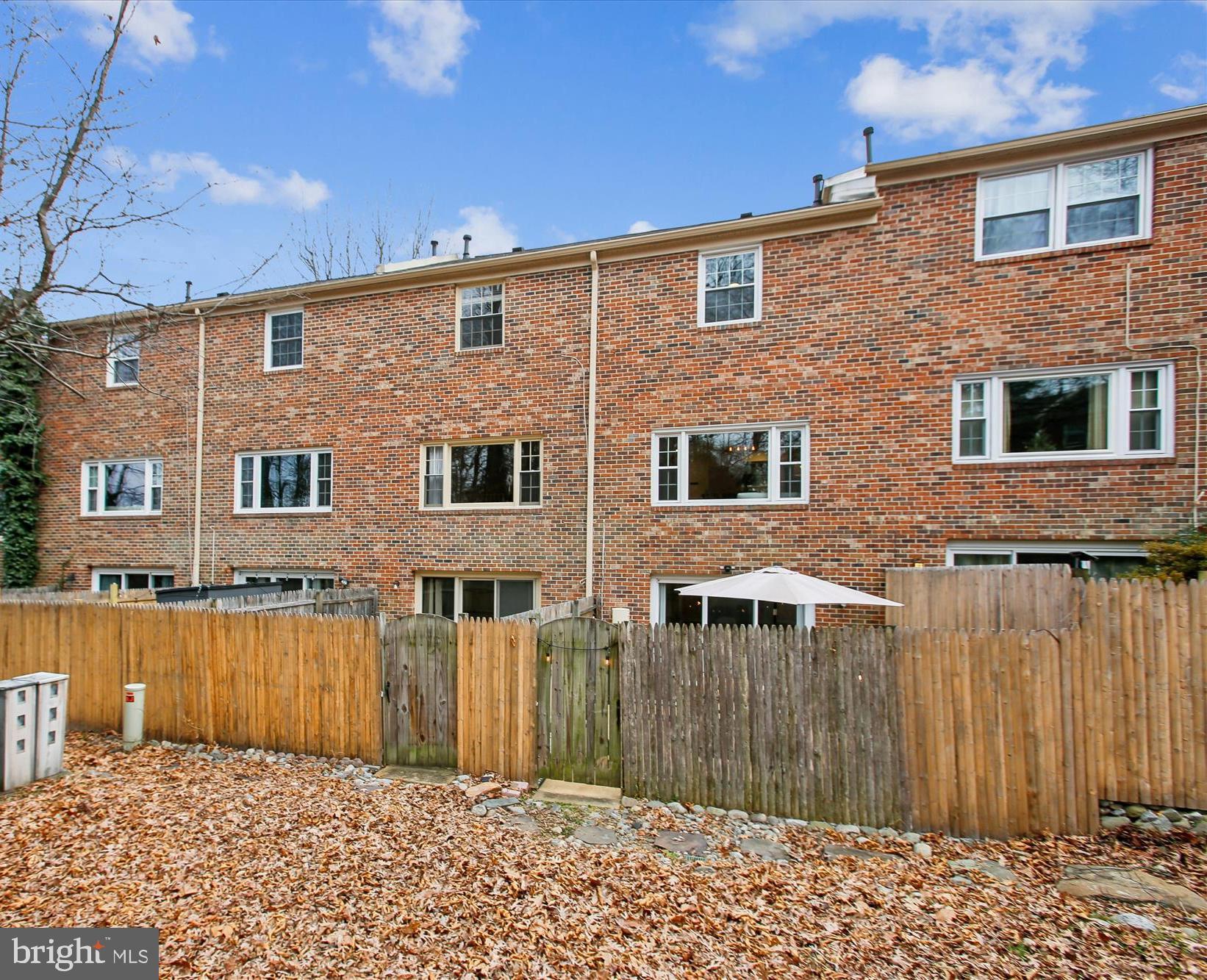 5818 Torington Drive, Unit 859 Springfield, VA 22152 - Photo 31 of 46 a front view of a house with a yard