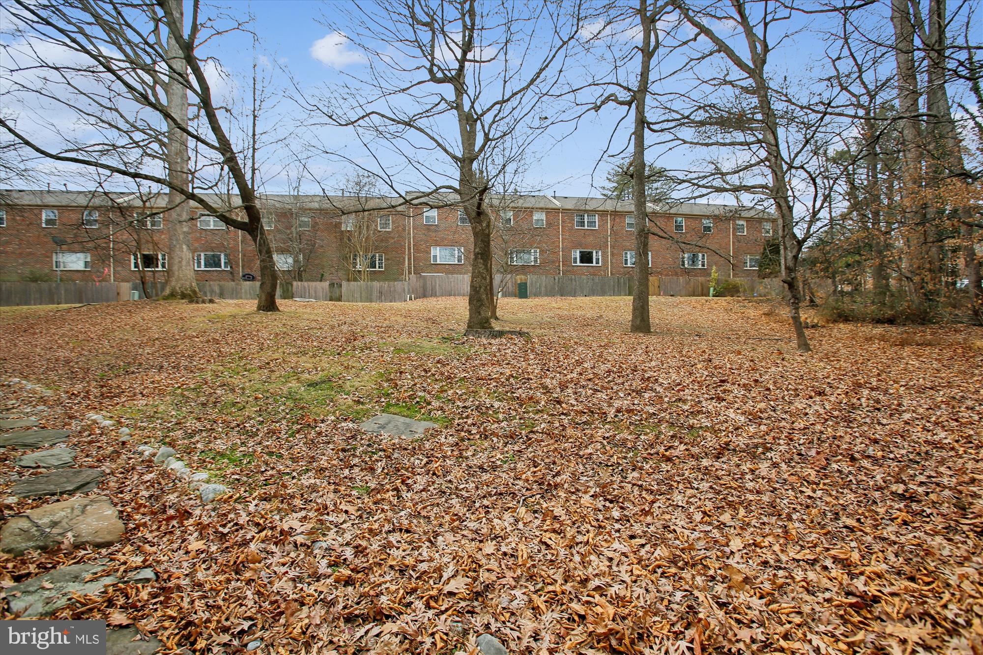 5818 Torington Drive, Unit 859 Springfield, VA 22152 - Photo 32 of 46 a house with trees in front of it