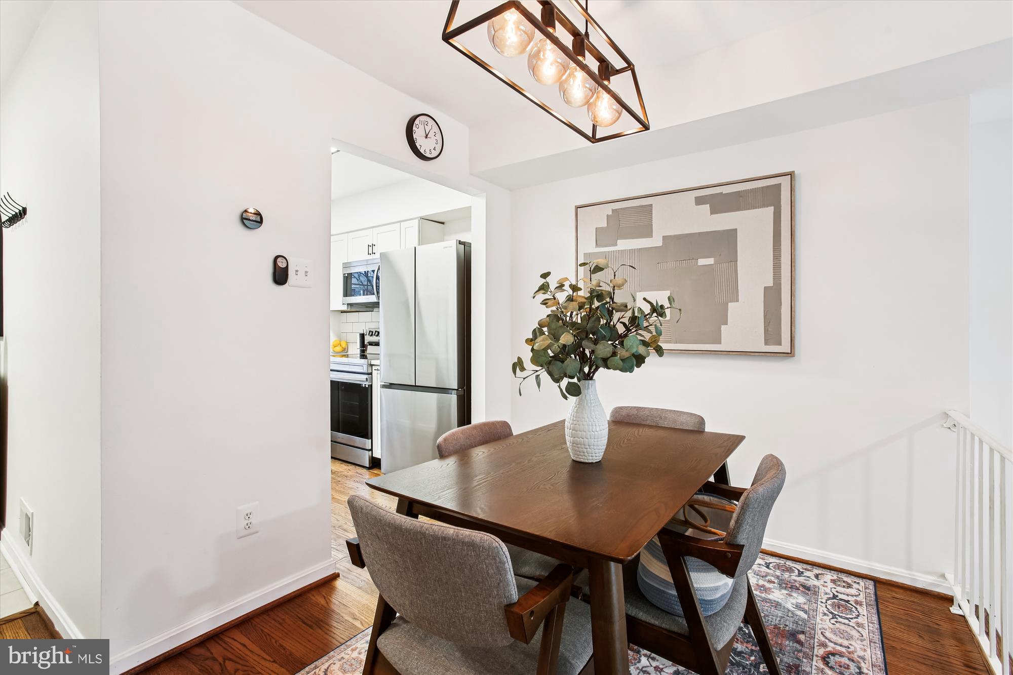 5818 Torington Drive, Unit 859 Springfield, VA 22152 - Photo 3 of 46 a dining room with furniture and wooden floor