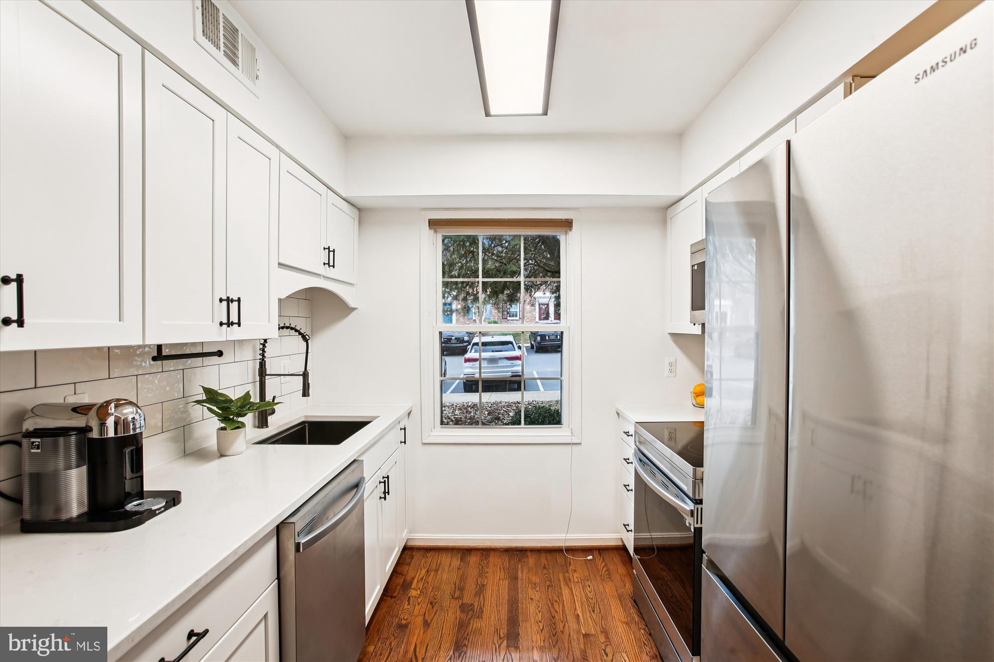 5818 Torington Drive, Unit 859 Springfield, VA 22152 - Photo 6 of 46 a kitchen with a refrigerator and a sink