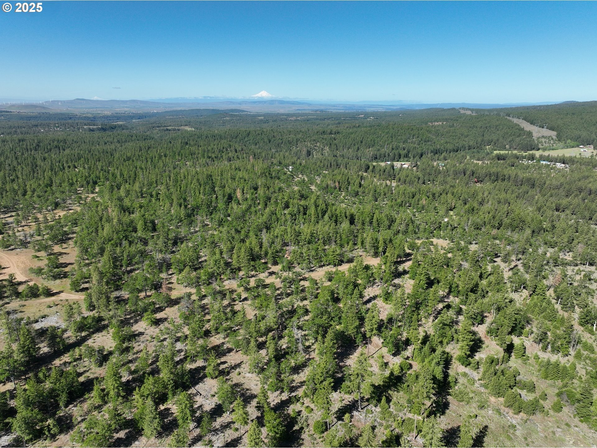 104 Jenkins Creek Road Goldendale, WA 98620 - Photo 12 of 45 an aerial view of residential houses with outdoor space and trees