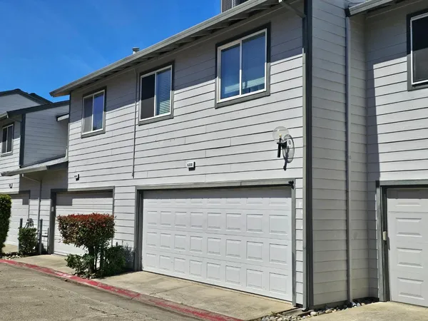 a front view of a house with a garage