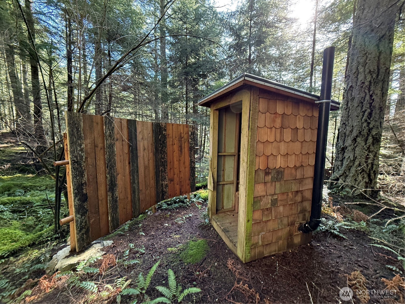 2000 Peregrine Road Orcas Island, WA 98279 - Photo 8 of 31 a front view of a house with a yard