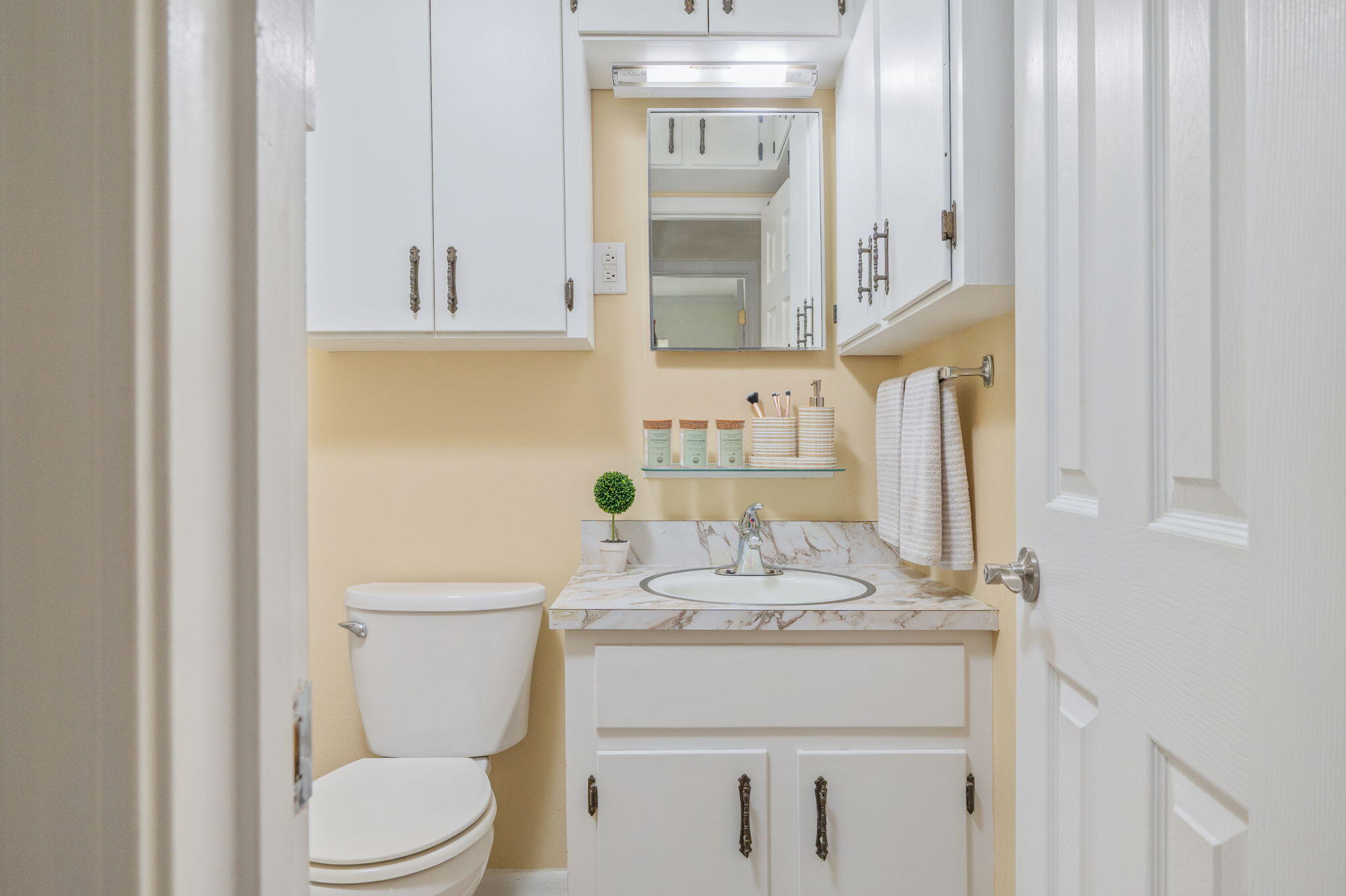 501 Jones Road Crestview, FL 32536 - Photo 24 of 32 a bathroom with a granite countertop sink and a toilet