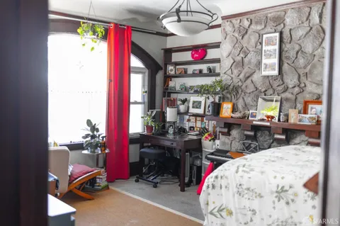 a view of a dining room with furniture and a window