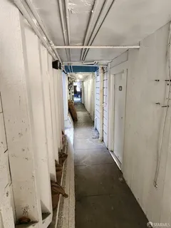 a view of a balcony with chair and wooden floor