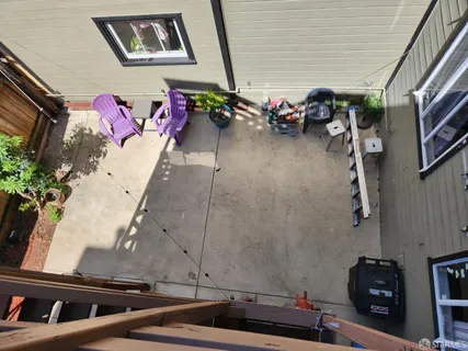 a vase of flowers sitting on a floor