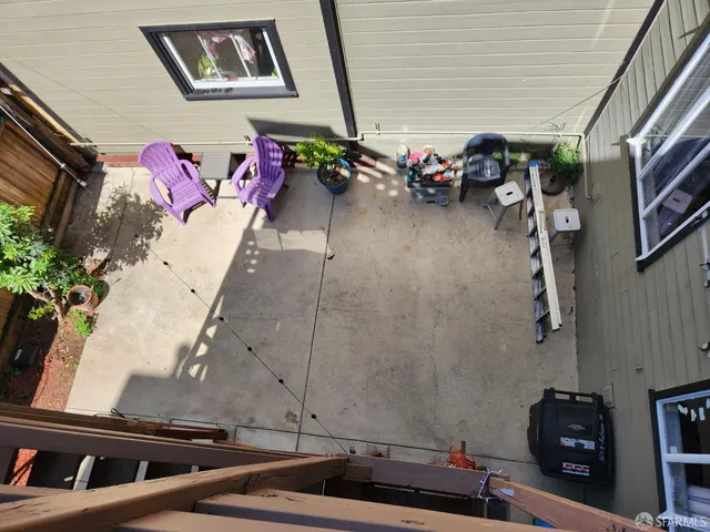 a vase of flowers sitting on a floor