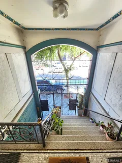 a view of living room with a floor to ceiling window and couch