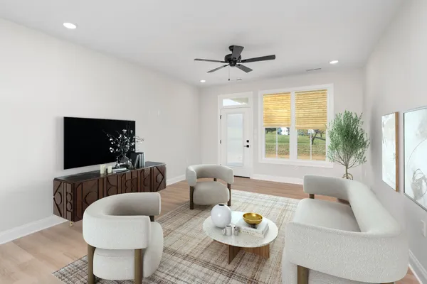 a living room with furniture and a flat screen tv