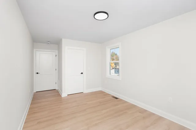 a view of a room that has a window in it