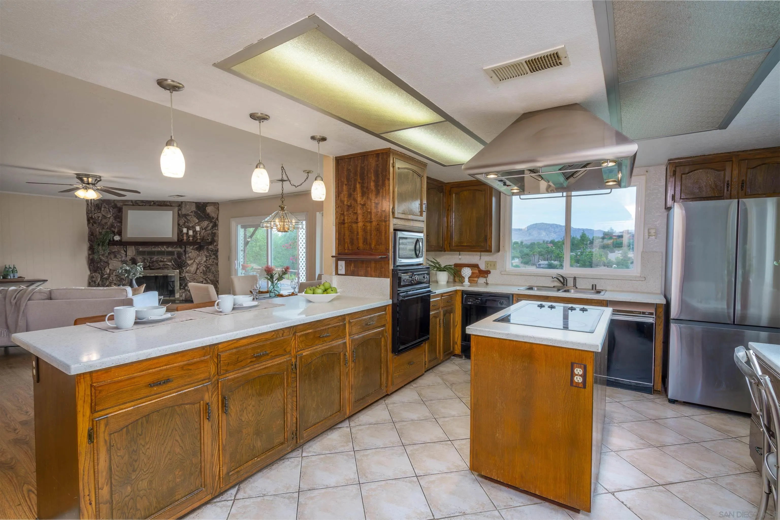 860 South Grade Road Alpine, CA 91901 - Photo 7 of 20 a kitchen with stainless steel appliances granite countertop a sink a stove and a refrigerator