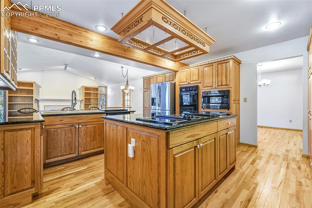 435 East Woodmen Road Colorado Springs, CO 80919 - Photo 16 of 50 a kitchen with stainless steel appliances granite countertop a sink and cabinets