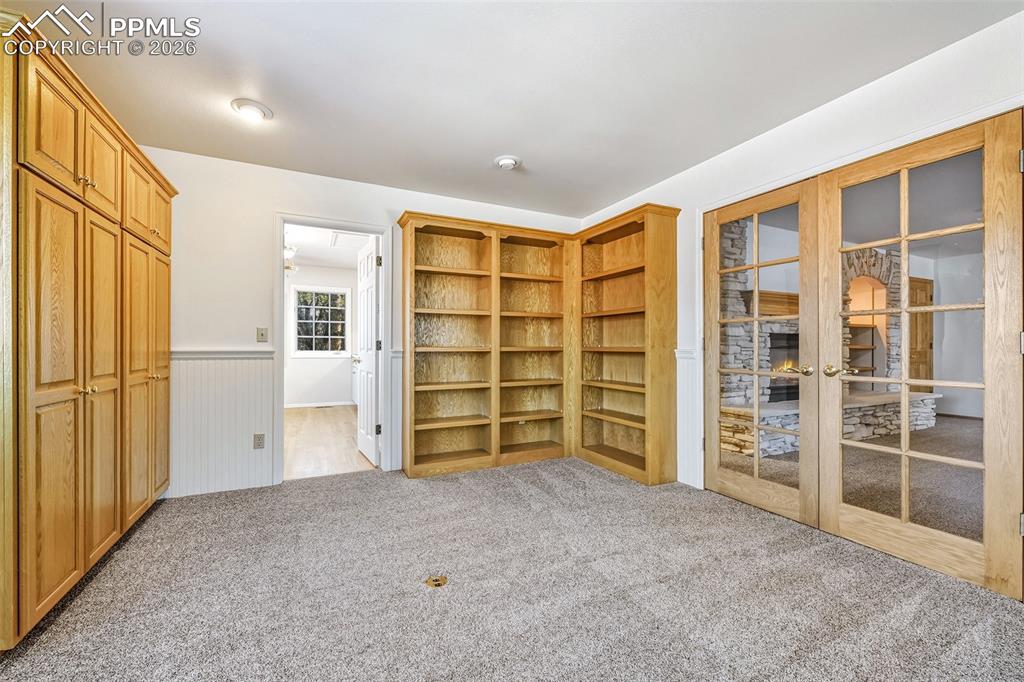 435 East Woodmen Road Colorado Springs, CO 80919 - Photo 24 of 50 an empty room with a closet and cabinet