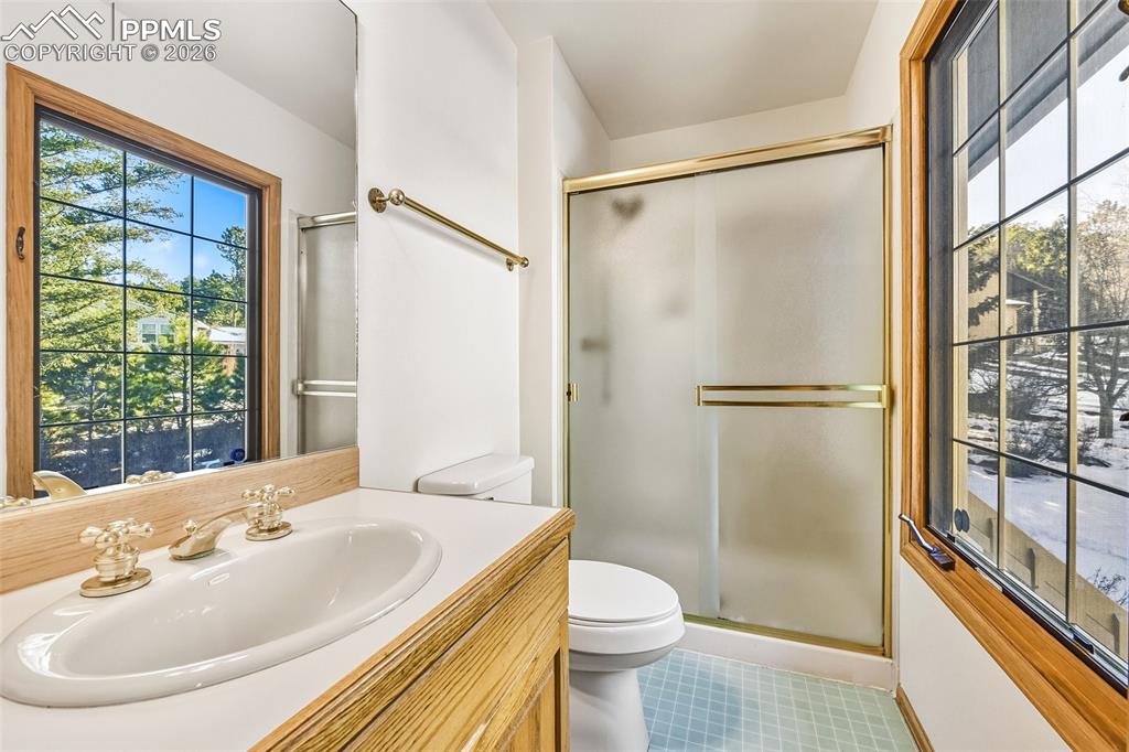 435 East Woodmen Road Colorado Springs, CO 80919 - Photo 29 of 50 a bathroom with a sink toilet and shower