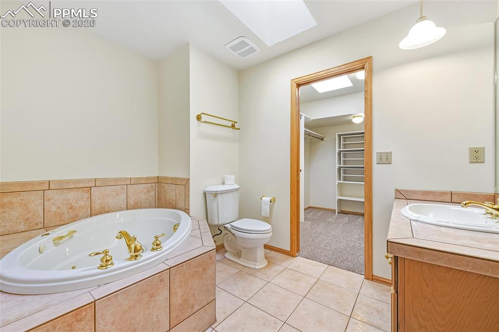 435 East Woodmen Road Colorado Springs, CO 80919 - Photo 30 of 50 a bathroom with a bathtub and a toilet