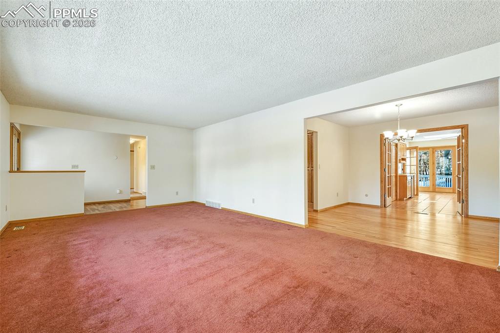 435 East Woodmen Road Colorado Springs, CO 80919 - Photo 34 of 50 a view of an empty room with window and wooden floor