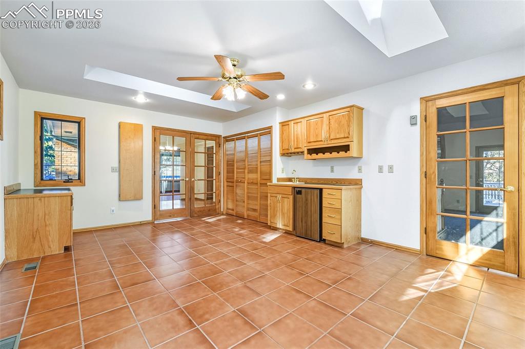 435 East Woodmen Road Colorado Springs, CO 80919 - Photo 38 of 50 a view of a livingroom with wooden furniture and windows