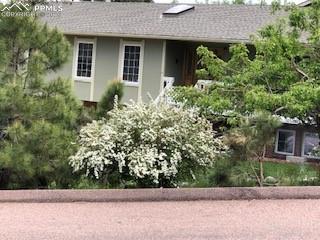435 East Woodmen Road Colorado Springs, CO 80919 - Photo 50 of 50 a front view of house with yard and green space