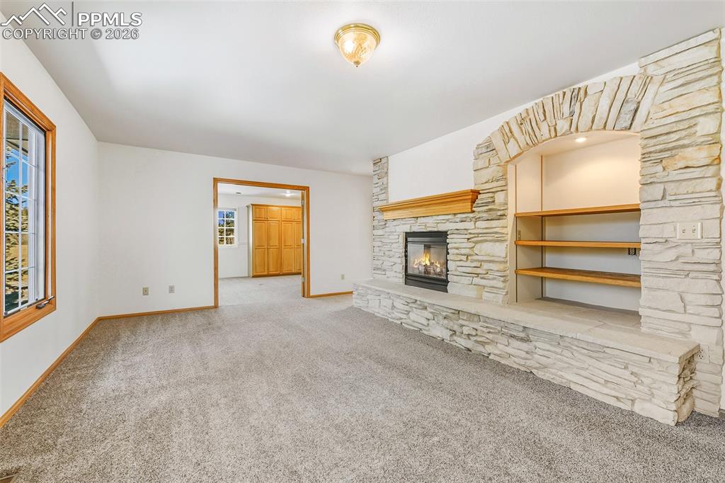 435 East Woodmen Road Colorado Springs, CO 80919 - Photo 5 of 50 a view of empty room with fireplace and fan