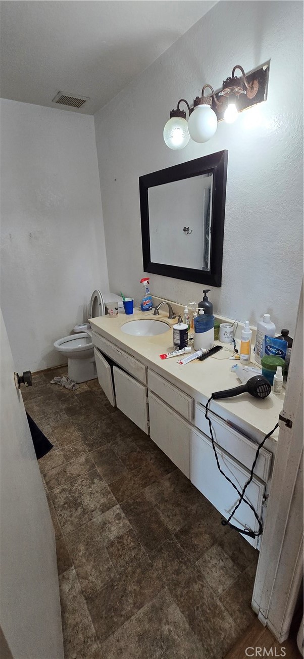 9370 Garden Grove Boulevard Garden Grove, CA 92844 - Photo 13 of 15 a bathroom with a sink vanity and mirror