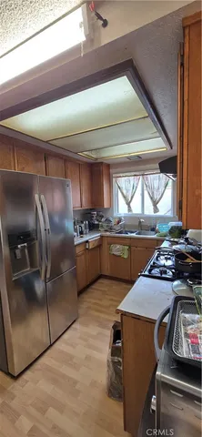 a kitchen with a stove a refrigerator and a stove
