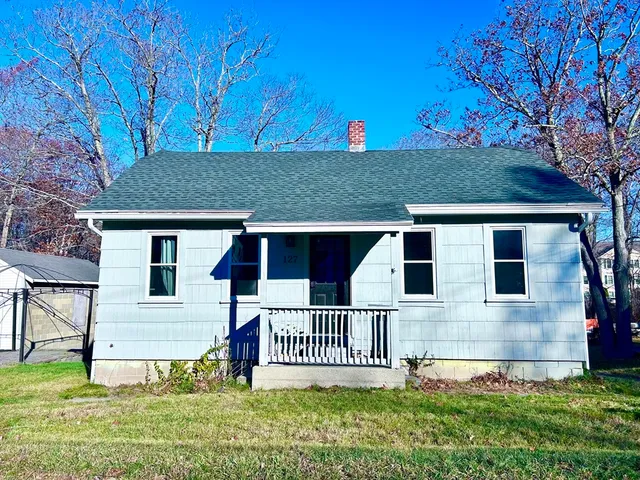 front view of a house with a yard