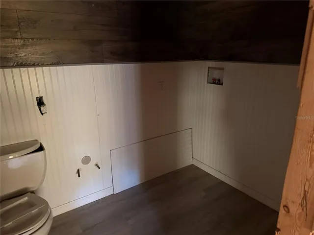 a view of hallway with wooden floor