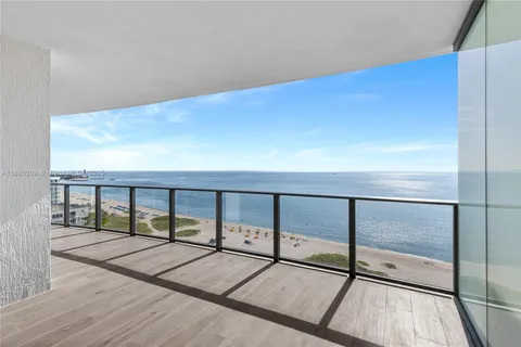 a view of balcony with wooden floor