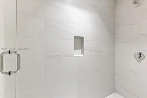 a view of a small space with wooden floor and closet