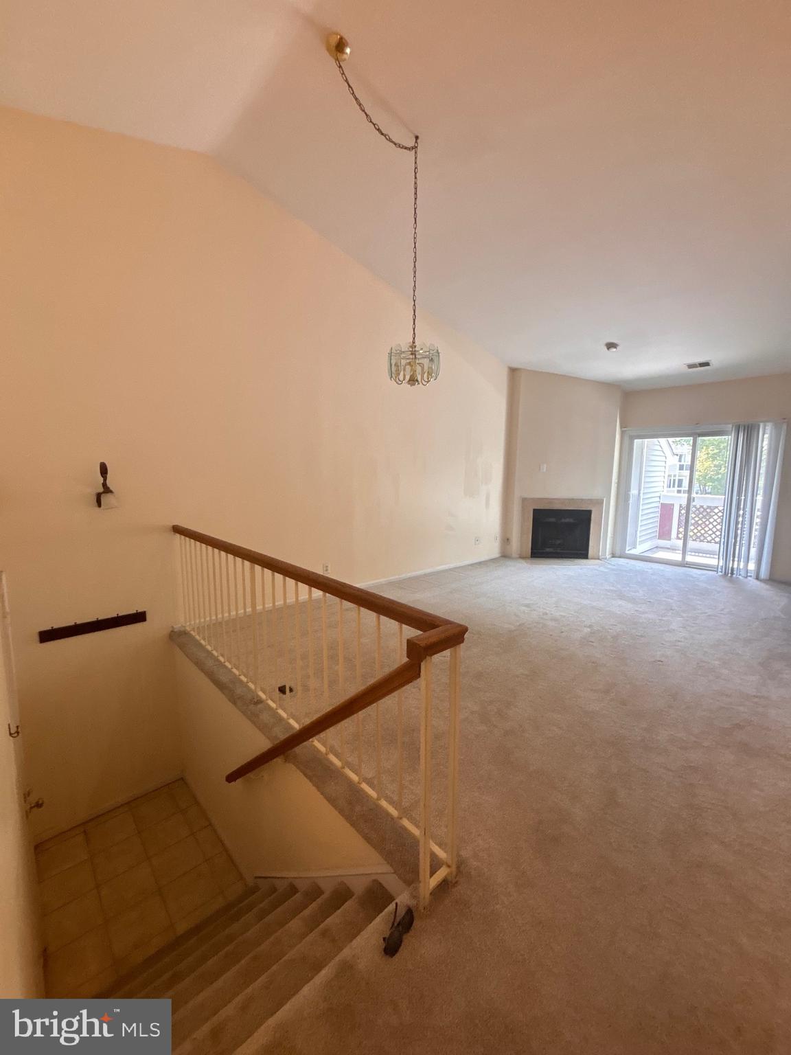 12889 C Grays Pointe Road, Unit 12889C Fairfax, VA 22033 - Photo 15 of 21 a view of a livingroom with wooden floor and staircase