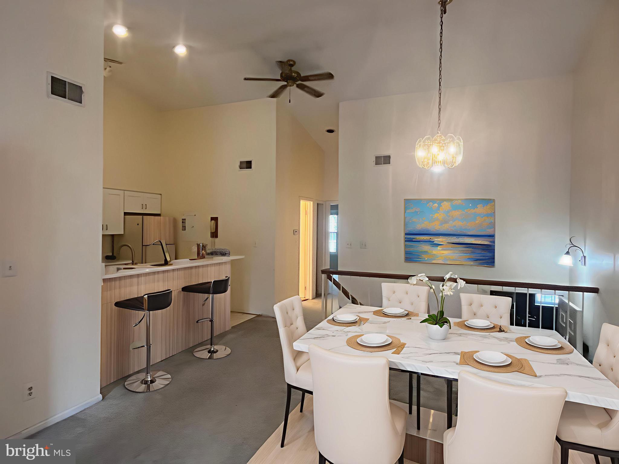 12889 C Grays Pointe Road, Unit 12889C Fairfax, VA 22033 - Photo 21 of 21 a room with a sink dishwasher a dining table and chairs