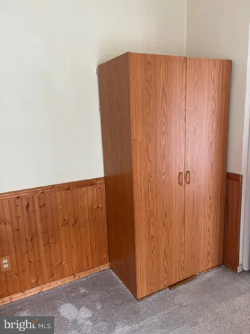 a view of a utility room with curtain