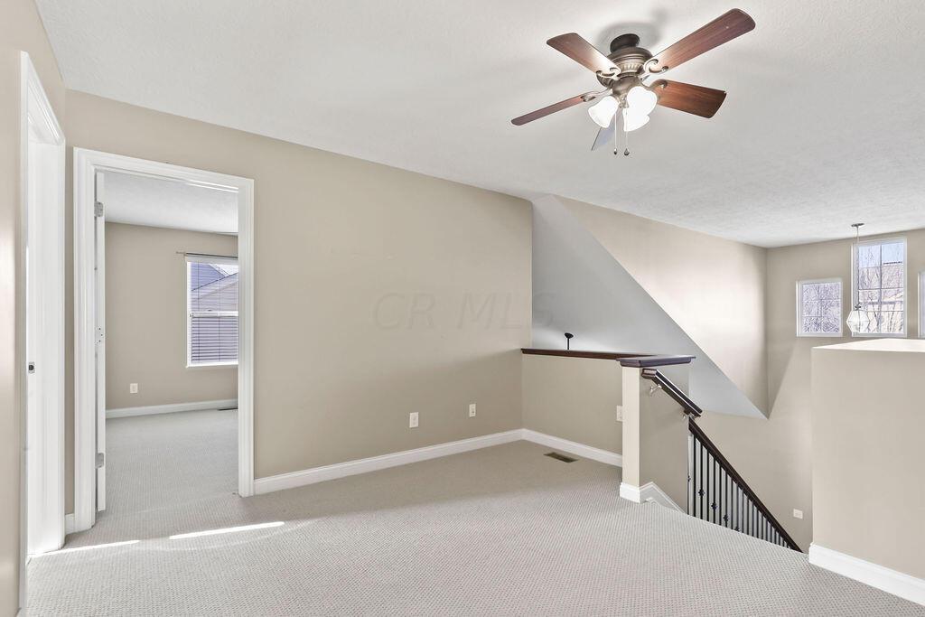 6163 Jennis Road Westerville, OH 43081 - Photo 24 of 44 • Tan carpet
• Tan painted walls
• Lighted ceiling fan
• Linen closet