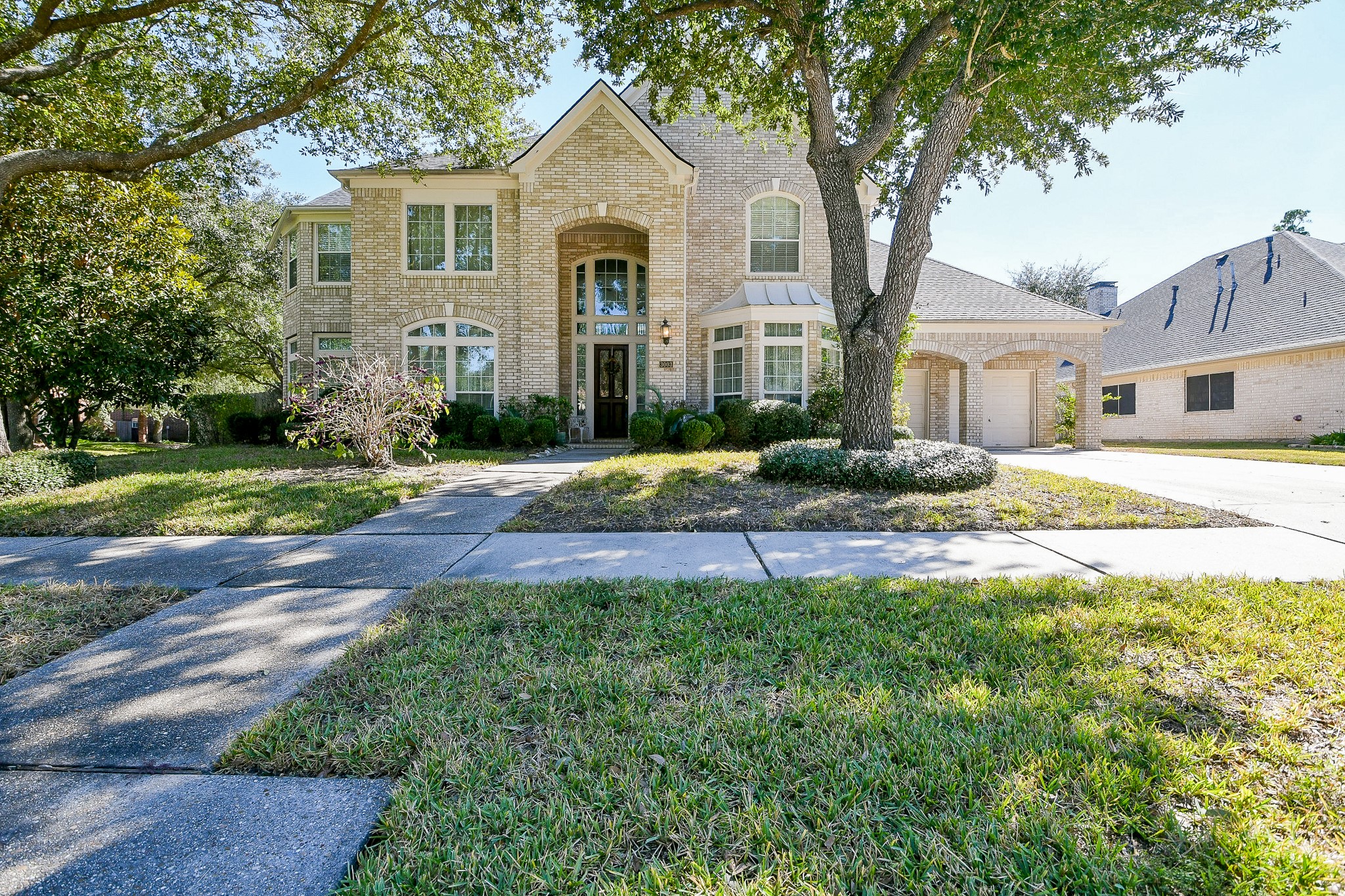 3003 Grand Noble Circle Houston, TX 77068 - Photo 1 of 32 a front view of a house with a yard