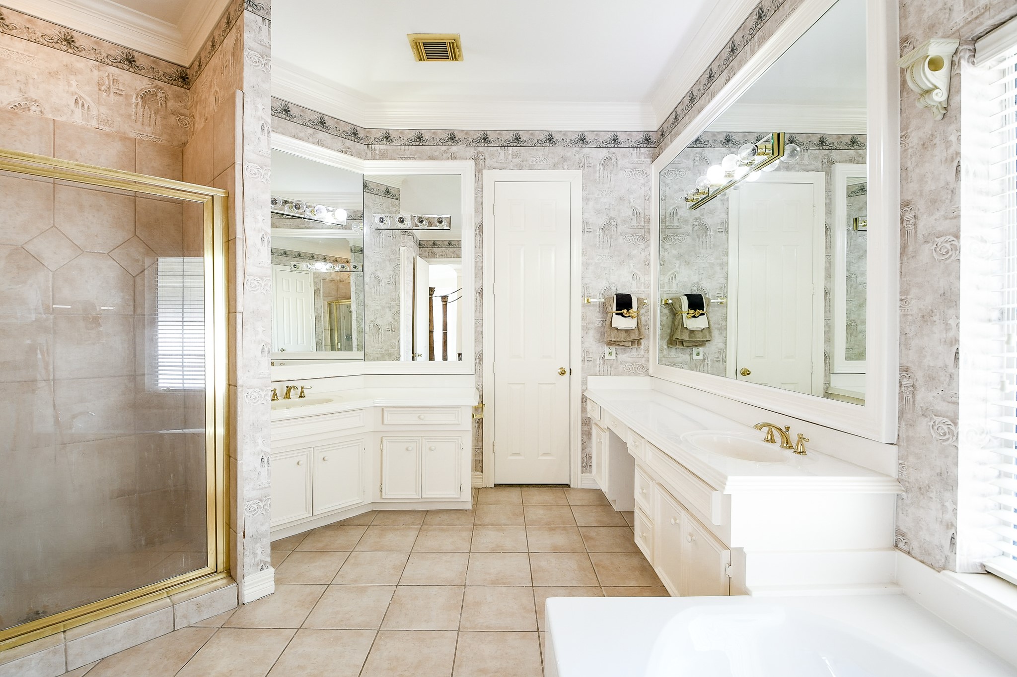 3003 Grand Noble Circle Houston, TX 77068 - Photo 19 of 32 a bathroom with a tub sink shower and mirror